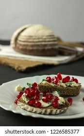 sandwich with cheese, greens and pomegranate berries 