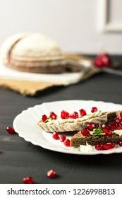 sandwich with cheese, greens and pomegranate berries 
