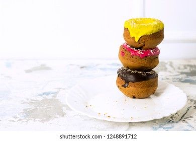 donuts stacked on a white background