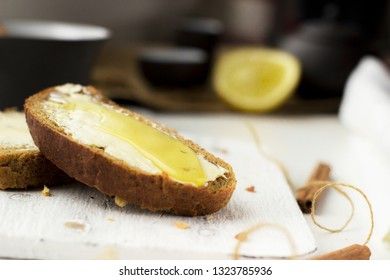 Pieces of bread with butter and honey, macro