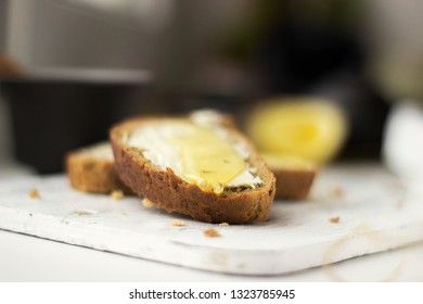 Pieces of bread with butter and honey, macro