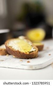 Pieces of bread with butter and honey, macro