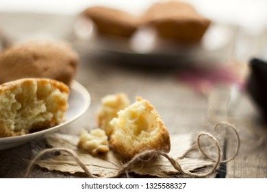 Sweet cupcakes on old wooden background.