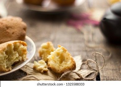 Sweet cupcakes on old wooden background.