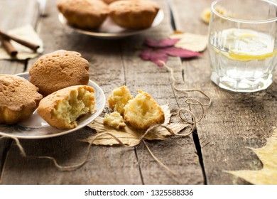 Sweet cupcakes on old wooden background.