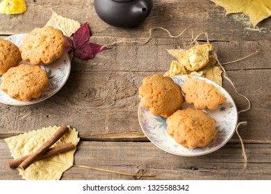 Sweet cupcakes on old wooden background.