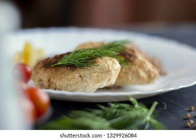 Chicken cutlets with buckwheat, herbs, ketchup and tomatoes