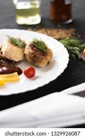 Chicken cutlets with buckwheat, herbs, ketchup and tomatoes