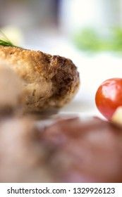 Chicken cutlets with buckwheat, herbs, ketchup and tomatoes