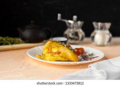 Baked chicken breast with onions and tomatoes on a white plate. Healthy food.