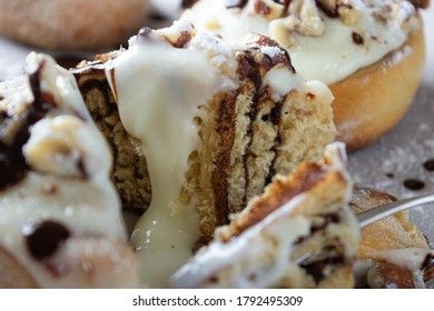 original cinnabon rolls with chocolate-cream sauce and hazelnuts