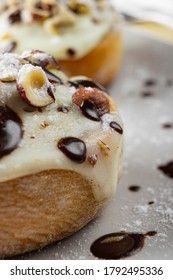 original cinnabon rolls with chocolate-cream sauce and hazelnuts
