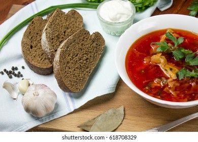 ukrainian, russian beetroot soup borscht on napkin on wooden background