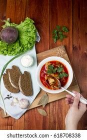 ukrainian, russian beetroot soup borscht on napkin on wooden background