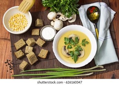 Cream pea soup with mushrooms, greens and breadcrumbs